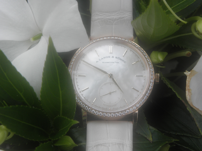 Soft white mother-of-pearl dials and white straps, as in this watch from A. Lange & Sohne, go perfectly with a summer tan.